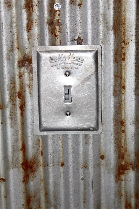 flush mounted switch boxes in corrugated metal|fixtures for corrugated metal.